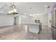 Bright and airy open-concept living space with recessed lighting and a view of the kitchen at 1222 Shorecrest Cir, Clermont, FL 34711