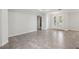 Large living room featuring tile flooring and white french doors at 1222 Shorecrest Cir, Clermont, FL 34711