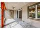 Cozy screened patio with ceiling fan and outdoor seating at 1222 Shorecrest Cir, Clermont, FL 34711