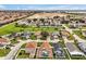 Features an overview of homes with backyard pools and a lush greenbelt for community enjoyment at 131 Sonja Cir # 1, Davenport, FL 33897