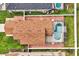 Aerial view of a home and an adjacent pool enclosed with a net at 131 Sonja Cir # 1, Davenport, FL 33897