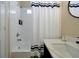 Well-lit bathroom featuring a shower-tub combination and vanity with white countertop at 131 Sonja Cir # 1, Davenport, FL 33897