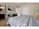 Well-appointed bedroom features a mounted TV, desk, and a closet, combining comfort with functionality for relaxation at 131 Sonja Cir # 1, Davenport, FL 33897