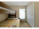 Bedroom features carpet, a bunk bed, and a window with blinds at 131 Sonja Cir # 1, Davenport, FL 33897