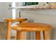 Close-up of a kitchen island featuring granite countertops and bar stools, perfect for casual dining and entertaining at 131 Sonja Cir # 1, Davenport, FL 33897