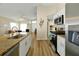Bright kitchen featuring stainless steel appliances, granite countertops, and an open floor plan at 131 Sonja Cir # 1, Davenport, FL 33897
