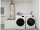 Laundry room features a water heater, washer, and dryer at 131 Sonja Cir # 1, Davenport, FL 33897