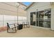 Cozy patio with seating area and sliding glass doors offers a relaxing outdoor living space and easy indoor access at 131 Sonja Cir # 1, Davenport, FL 33897