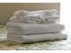 Close up of folded white towels on a patterned blanket at 131 Sonja Cir # 1, Davenport, FL 33897