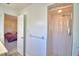 An ensuite bathroom features a shower and doorway leading to the bedroom at 16 Cedar Dr, Davenport, FL 33837