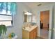 A bathroom features a vanity and nautical accents at 16 Cedar Dr, Davenport, FL 33837