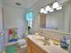 A cozy bathroom featuring a vanity and nautical accents at 16 Cedar Dr, Davenport, FL 33837