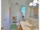 Bright bathroom featuring a vanity and nautical accents at 16 Cedar Dr, Davenport, FL 33837