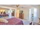 Bedroom includes mirrored closet doors and an ensuite bathroom at 16 Cedar Dr, Davenport, FL 33837