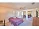 Bright bedroom includes a ceiling fan, carpet, and mirrored closet doors at 16 Cedar Dr, Davenport, FL 33837
