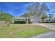 Charming home with a manicured lawn, neatly trimmed hedges, and a two-car garage at 16 Cedar Dr, Davenport, FL 33837