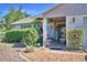 Inviting front porch with brick facade, plants, and a well-manicured lawn at 16 Cedar Dr, Davenport, FL 33837