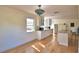 Bright kitchen with a vintage light fixture, center island, hardwood floors, and modern appliances at 16 Cedar Dr, Davenport, FL 33837