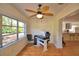 Bright office space with hardwood floors, large window, and modern ceiling fan at 16 Cedar Dr, Davenport, FL 33837