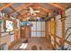 Spacious shed interior with a ceiling fan, storage, and wooden flooring at 16 Cedar Dr, Davenport, FL 33837