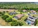 Expansive aerial view of upscale homes featuring screened pools, solar panels, and lush landscaping at 16548 Caravaggio Loop, Montverde, FL 34756