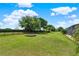 Spacious backyard with lush lawn and manicured landscaping, perfect for outdoor activities and enjoyment at 16548 Caravaggio Loop, Montverde, FL 34756