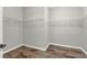 Walk-in closet with wooden floor and wire shelving at 16548 Caravaggio Loop, Montverde, FL 34756