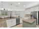 Spacious kitchen boasts granite countertops, stainless steel appliances and a view to the living room at 16548 Caravaggio Loop, Montverde, FL 34756