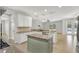 Open concept kitchen featuring granite counters, stainless appliances, tiled backsplash and island at 16548 Caravaggio Loop, Montverde, FL 34756
