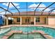 Inviting screened-in pool with a spa and covered patio, perfect for outdoor entertaining at 16548 Caravaggio Loop, Montverde, FL 34756