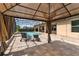 Inviting outdoor patio and pool area with a gazebo, ideal for relaxation and entertaining at 16548 Caravaggio Loop, Montverde, FL 34756