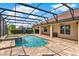 Resort-style screened-in pool with a spa and an expansive outdoor living area at 16548 Caravaggio Loop, Montverde, FL 34756