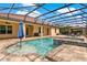 Beautiful screened-in pool with a spa, gazebo, and lush surroundings for ultimate relaxation at 16548 Caravaggio Loop, Montverde, FL 34756