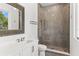 Bathroom with a large mirror, a white vanity, and a glass-enclosed shower with tiled walls at 1660 Palmer Ave, Winter Park, FL 32789