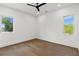 Bright bedroom with hardwood floors, two windows, a modern ceiling fan, and recessed lighting at 1660 Palmer Ave, Winter Park, FL 32789