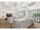 Gourmet kitchen featuring double islands with marble countertops and seamless flow to the living spaces at 1660 Palmer Ave, Winter Park, FL 32789
