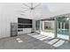 Bright living area features tile floors, custom cabinets, and sliding glass doors to the pool area at 1660 Palmer Ave, Winter Park, FL 32789