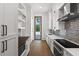 Walk-in pantry with ample storage, counter space, and modern appliances for easy meal preparation at 1660 Palmer Ave, Winter Park, FL 32789