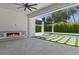 Covered patio features a fireplace, and a beautiful view of the pool and backyard at 1660 Palmer Ave, Winter Park, FL 32789
