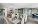 Open floor plan shows modern kitchen and dining room with white table and seats at 1736 Three Bars Rd, Kissimmee, FL 34744