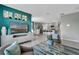 Open concept living room with views of dining room and modern kitchen at 1736 Three Bars Rd, Kissimmee, FL 34744