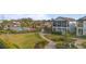 Aerial view showcasing community amenities, including a pool and green spaces at 1763 White Feather Loop, Oakland, FL 34787