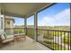 Relaxing screened balcony with comfortable seating and beautiful neighborhood views at 1763 White Feather Loop, Oakland, FL 34787