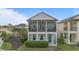 Charming two-story home with a screened-in porch, landscaped yard, and inviting curb appeal at 1763 White Feather Loop, Oakland, FL 34787