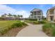 Charming two-story home with a lovely walkway, lush landscaping, and inviting front porch at 1763 White Feather Loop, Oakland, FL 34787