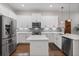 Sleek kitchen featuring stainless steel appliances, granite countertops, and a spacious design at 1763 White Feather Loop, Oakland, FL 34787