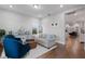 Comfortable living room featuring neutral tones, stylish furnishings, and lots of light at 1763 White Feather Loop, Oakland, FL 34787