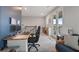 Comfortable home office with a desk and a view to the outside balcony at 1763 White Feather Loop, Oakland, FL 34787