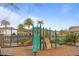 Community playground featuring slides, climbing structures, and a secure fenced area at 1763 White Feather Loop, Oakland, FL 34787
