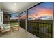 Relaxing screened porch with comfortable seating and a beautiful outdoor view at 1763 White Feather Loop, Oakland, FL 34787